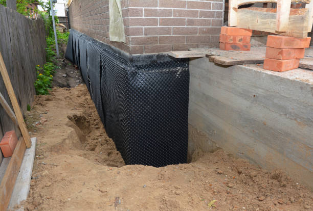 Happy homeowners after waterproofing job in Linwood